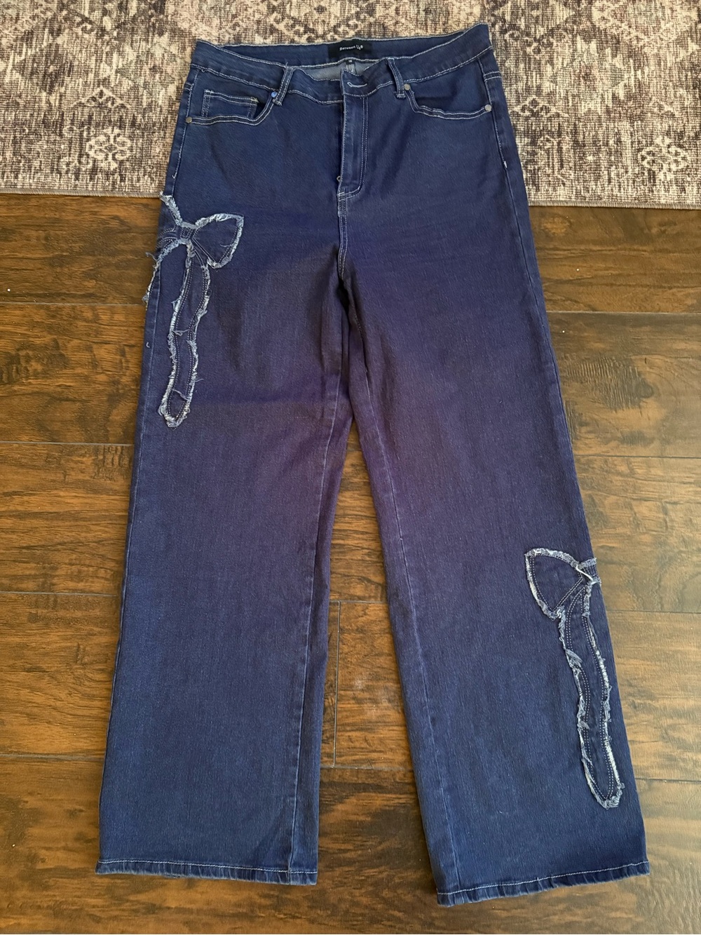 Women’s Indigo Boot-Cut Jeans with Distressed Bow Appliqués